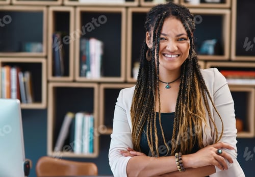 Preview: Cropped portrait of an attractive young woman standing with her arms crossed in her home office