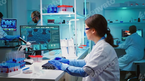 Preview: Overworked chemist looking tired at camera
