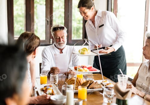 Preview: Friends having breakfast at a hotel