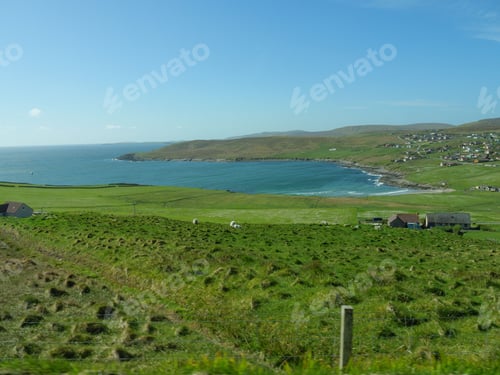 Preview: Stunning view of the Shetland Islands in Scotland, UK, blanketed in lush greenery and a tranquil sea
