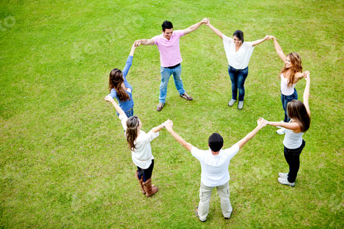 Preview: Group Of People In A Circle Holding Hands - Outdoors