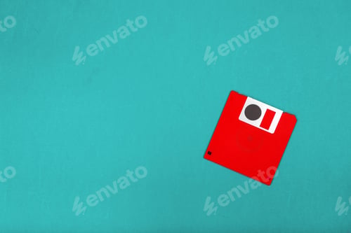 Preview: Red floppy disk on a blue background with a simple design showing retro technology items