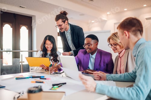 Preview: Multiracial business group of people having a meeting in an office
