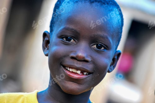 Preview: Little african boy smiling into the camera