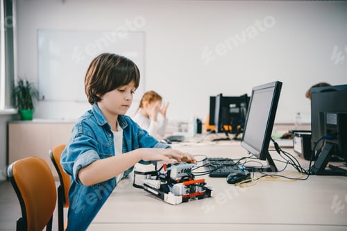Preview: teen kid programming diy robot at machinery class