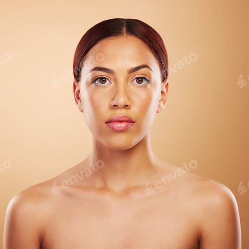 Preview: Portrait, skincare and woman with cosmetics, beauty and wellness against a brown studio background.