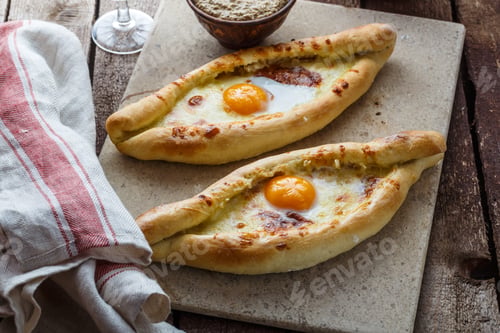 Preview: Two ajarian khachapuri, georgian bread with cheese and yolk