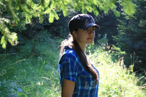 Preview: Beautiful girl portrait in the wood under the sunlight