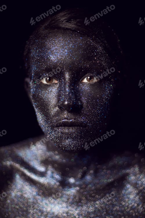 Preview: fashionable portrait of a woman in black paint with sequins on her face. open eyes