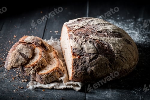 Preview: Healthy loaf of bread for breakfast on linen cloth