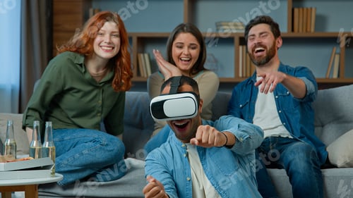 Preview: Gaming group multiracial ethnic diverse friends women men on couch support african american man