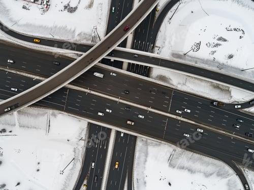 Preview: Aerial view of a freeway intersection Snow-covered in winter.
