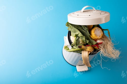 Preview: High angle view of organic waste in compost bin by copy space on blue background