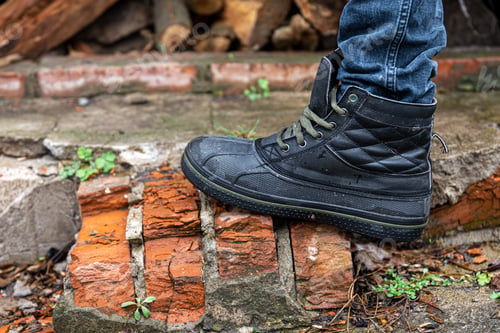 Preview: A pair of durable men's boots, legs close-up.