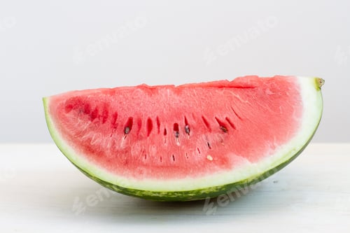 Preview: slices of juicy ripe watermelon on white table