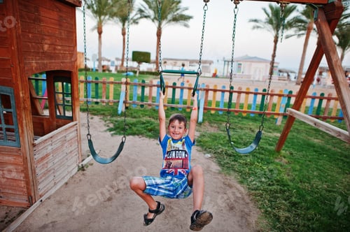 Preview: Boy at playground of egyptian resort.
