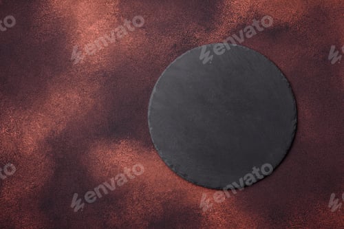 Preview: Empty ceramic round plate on dark textured concrete background