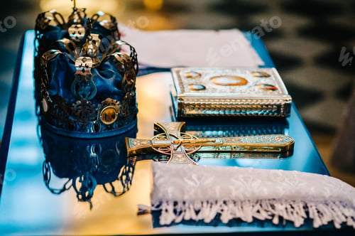 Preview: Wedding crowns and bible. Wedding crown in church ready for marriage ceremony. close up. Divine