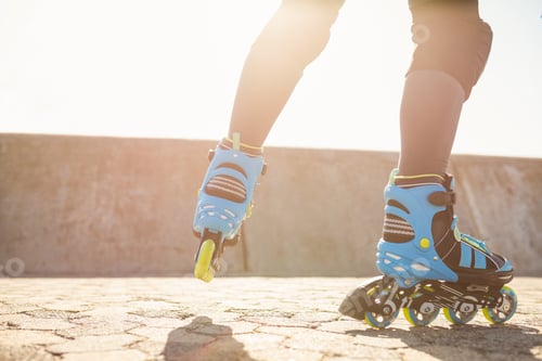 Preview: Close up view of inline skates skating at promenade