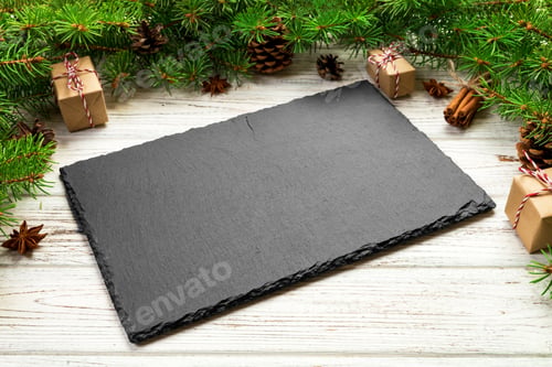 Preview: Perspective view. Empty black slate rectangular plate on wooden christmas background