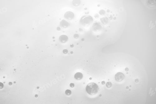 Preview: Gentle soap sud foam with bubbles from moisturizer shampoo, shower gel or facial cleanser on water