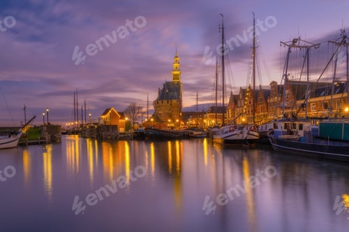 Preview: Hoorn, Netherlands. An ancient harbor and marina. Old sailing ships. View of houses during evening.