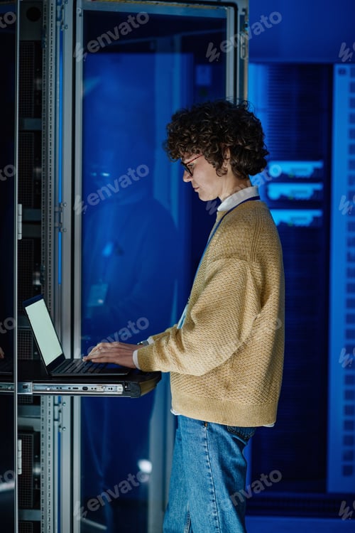 Preview: Female IT engineer configuring servers