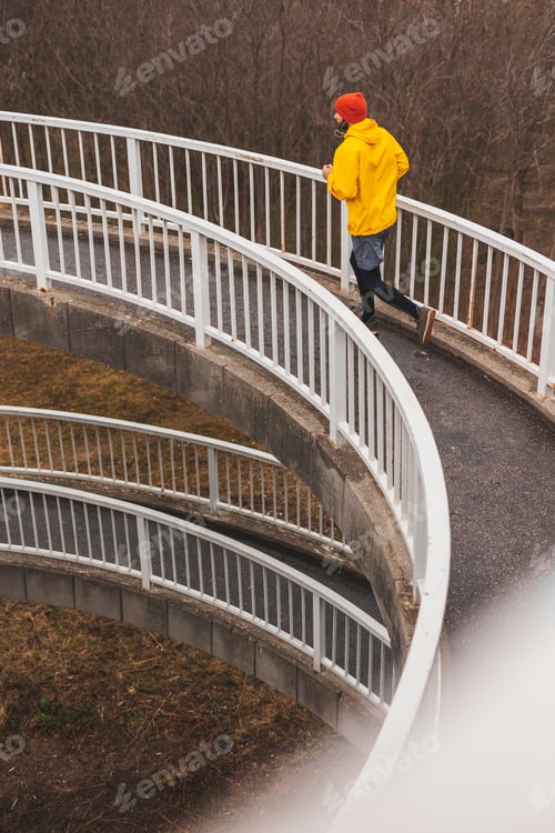 Preview: Man jogging on rainy cloudy day