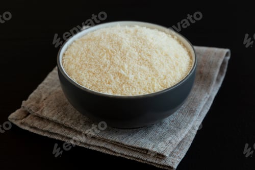 Preview: Organic Grated Parmesan Cheese in a Bowl, side view.