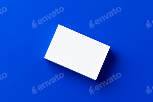 Preview: Blank white businesscards on classic blue background
