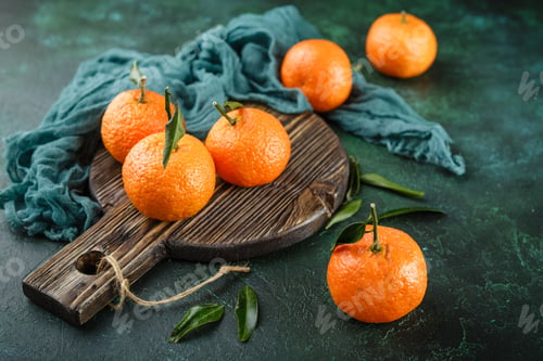 Preview: Tangerines oranges, mandarins, clementines, citrus fruits with leaves