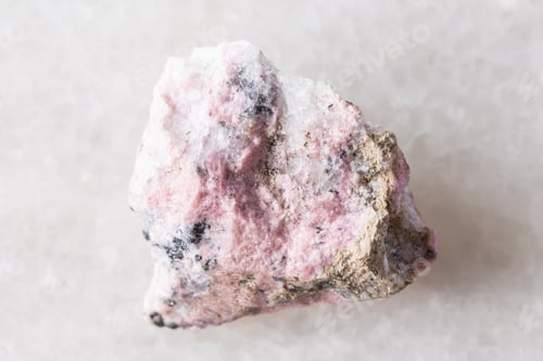 Preview: sample of raw pyroxmangite mineral on white marble