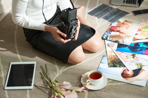Preview: Unrecognizable Photographer Sitting with Camera