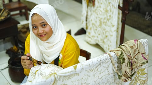 Preview: Asian women learn to make batik wearing jilbab and analog camera