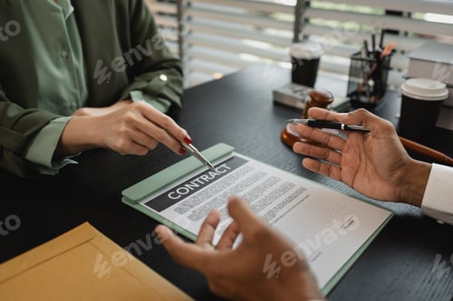 Preview: lawyers looking through client document together