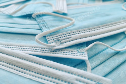 Preview: Close-up full frame image of stacked surgical masks.