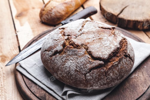 Preview: Delicious fresh bread on wooden background