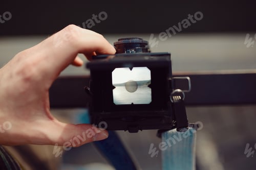 Preview: The red-haired guy holding a medium format film camera in his hands