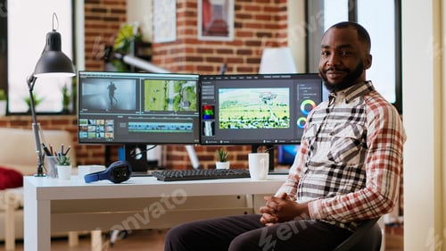 Preview: Male filmmaker editing video montage on professional software