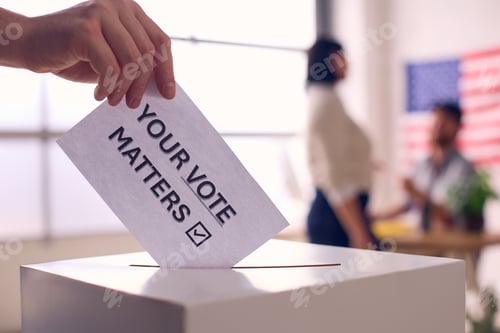 Preview: Hand Placing Ballot in Box With Your Vote Matters