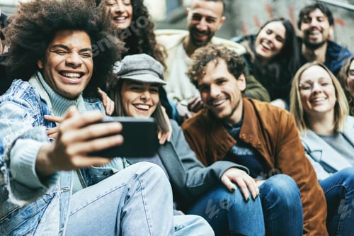 Preview: Young diverse people using mobile phone doing selfie outdoor - Focus on african guy face