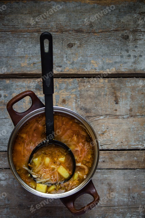Preview: First Dish In A Saucepan With A Ladle - Tomato Soup With Cabbage, Broccoli And Other Vegetables