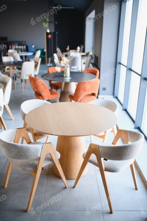 Preview: Furniture showroom featuring modern dining tables and chairs