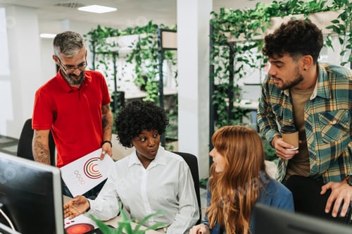 Preview: A multicultural team is working together on project at modern office.
