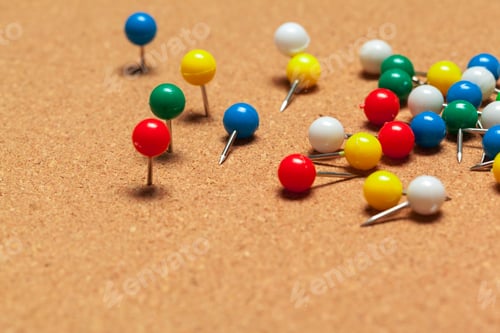 Preview: Group of thumbtacks on corkboard close up. School or business concept