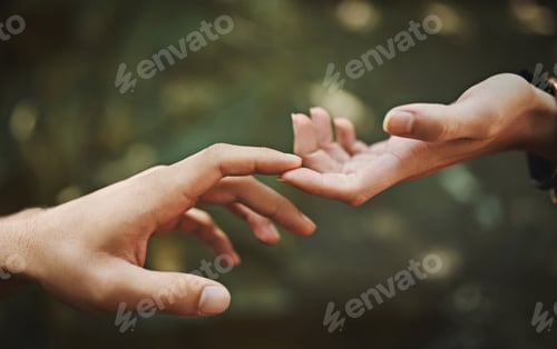 Preview: Reach out and touch someone. Cropped shot of a couple touching each others fingers.
