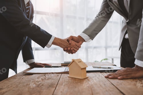 Preview: Handshake of real estate brokers with customers or investors, mortgage loan agreements Make a lease-