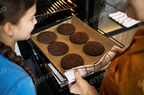 Preview: Mother and Daughter Baking Chocolate Cookies at Home Together