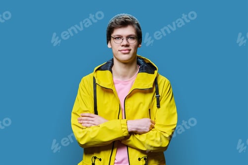 Preview: Handsome guy posing in outwear, on blue background