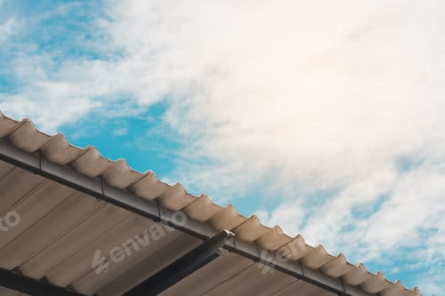 Preview: Roof tiles and blue sky with clouds